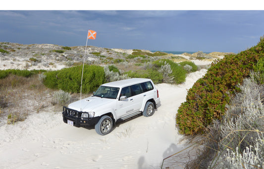 Sand flag mounted on a 4WD, a crucial accessory for off-road safety on beaches and 4x4 tracks.